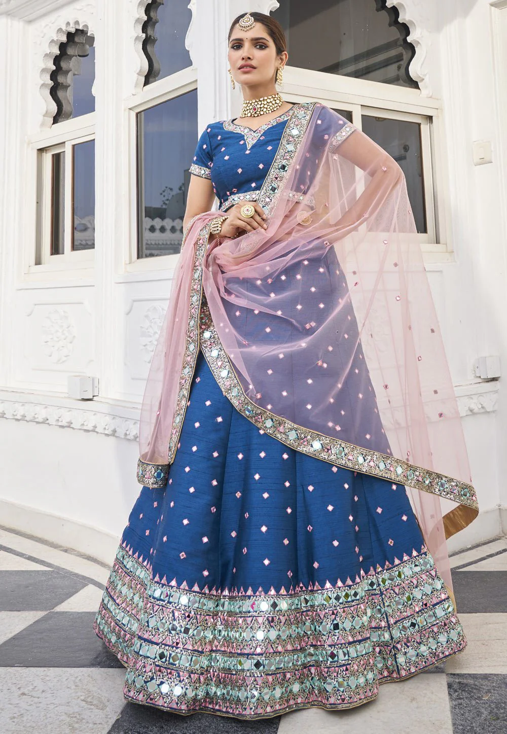 Inviting Blue Mirror Work Embroidered Wedding Lehenga Choli