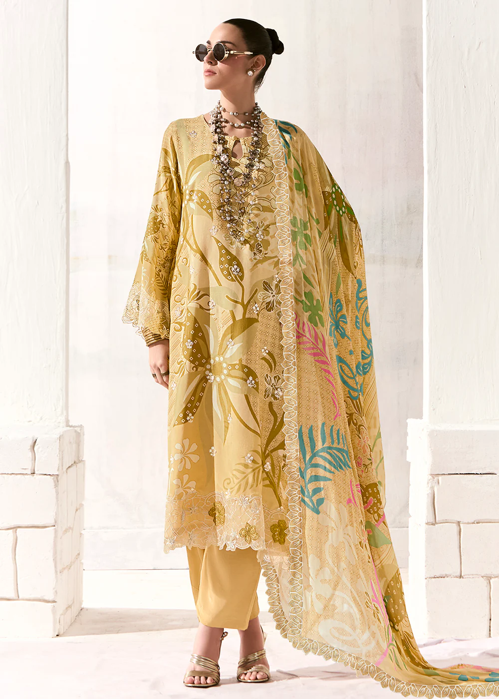 Yellow Printed & Embroidered Muslin Salwar Suit